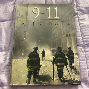 9-11 a tribute 192 pgs of photos and stories. Hardback book .
